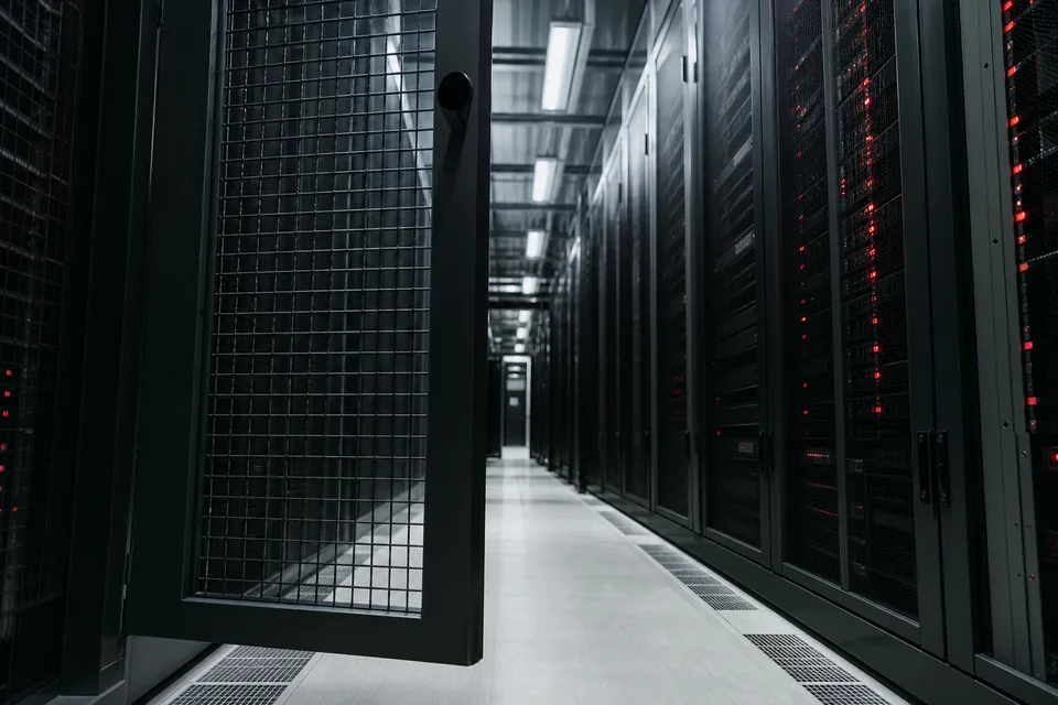 Server room aisle with a locked access gate